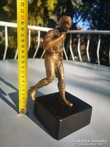 The football player with golden legs, soccer player, copper statue