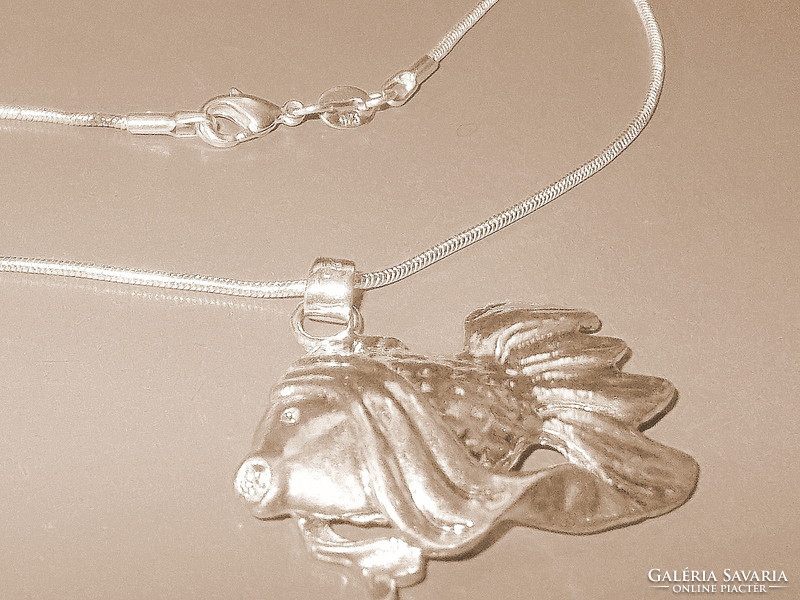 Big carp-fish for anglers with Tibetan silver necklace