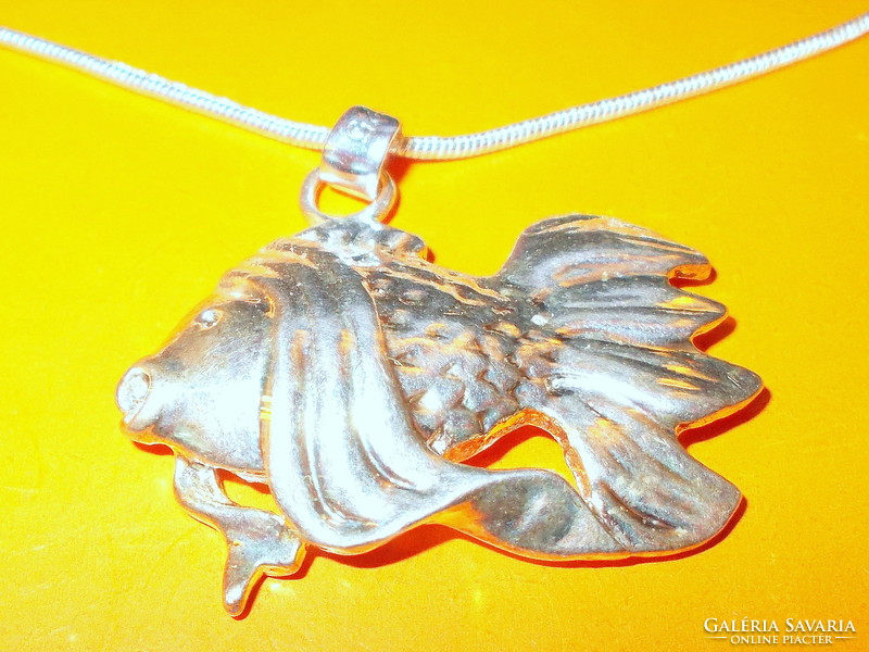 Big carp-fish for anglers with Tibetan silver necklace