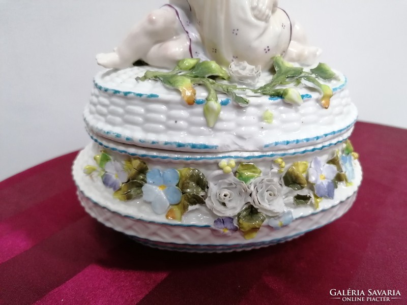 Old porcelain bonbonier with figural decoration