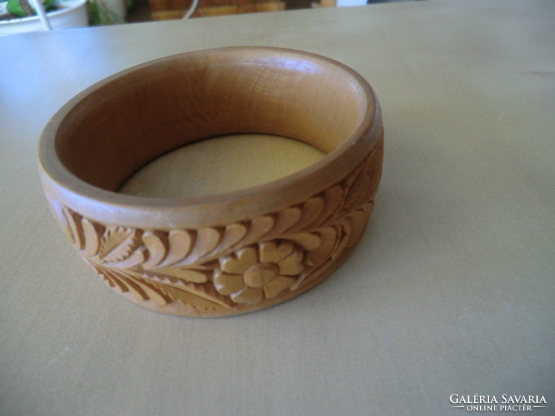 Bracelet carved from wood with an inner diameter of 6.5 outer 8 cm. Its width is 3 cm.
