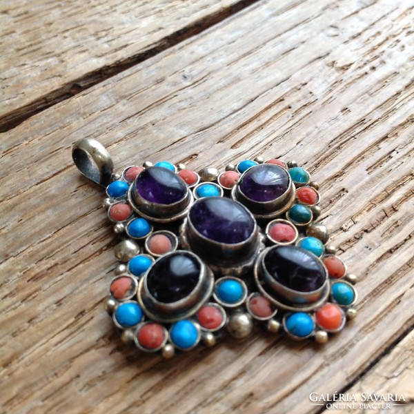 Craft pendant decorated with amethyst, coral and turquoise stones