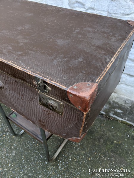 Vintage suitcase with leather strap