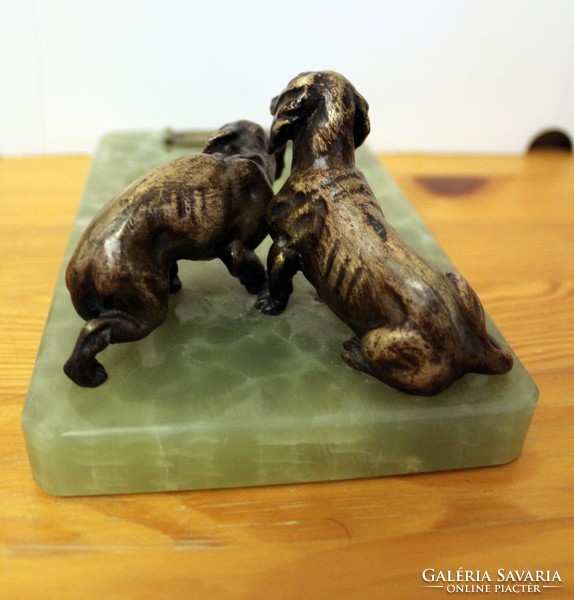 Dachshunds on a marble pedestal