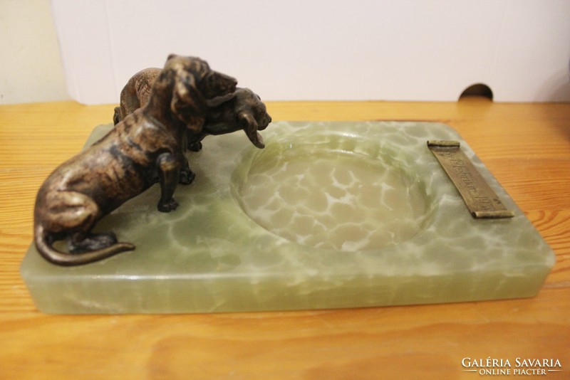 Dachshunds on a marble pedestal