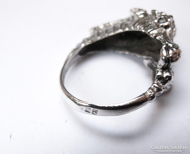 Showy silver ring with seahorse.