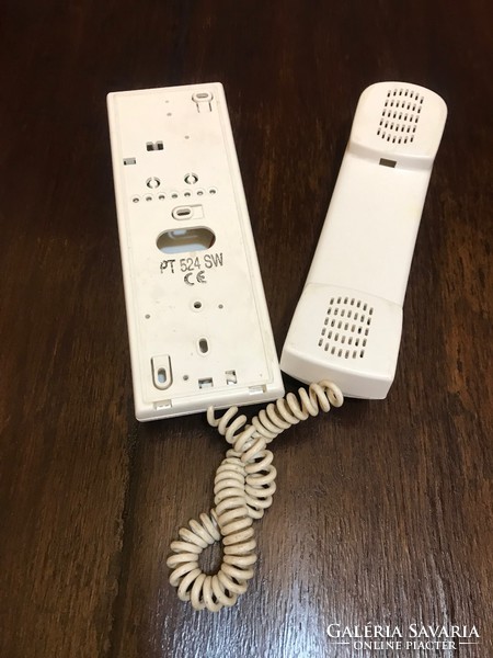 White wall mounted landline phone. Nice, spared condition.