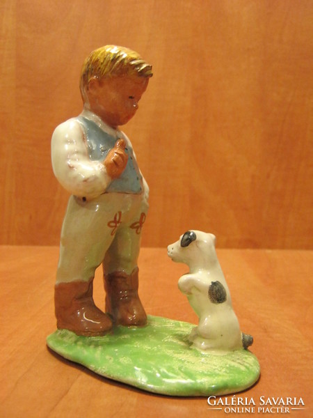 Sweaty ceramic little boy with dog