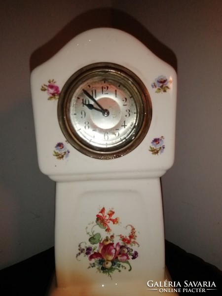 Antique table clock in a ceramic case