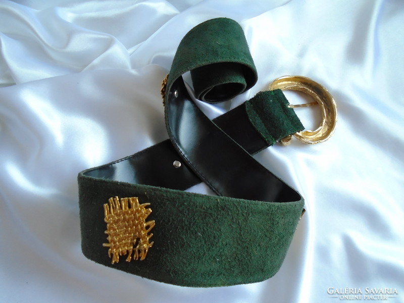 Leather belt with gold-colored metal embellishments.