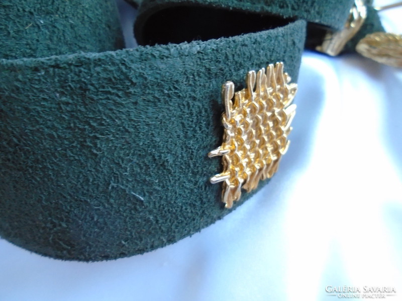 Leather belt with gold-colored metal embellishments.