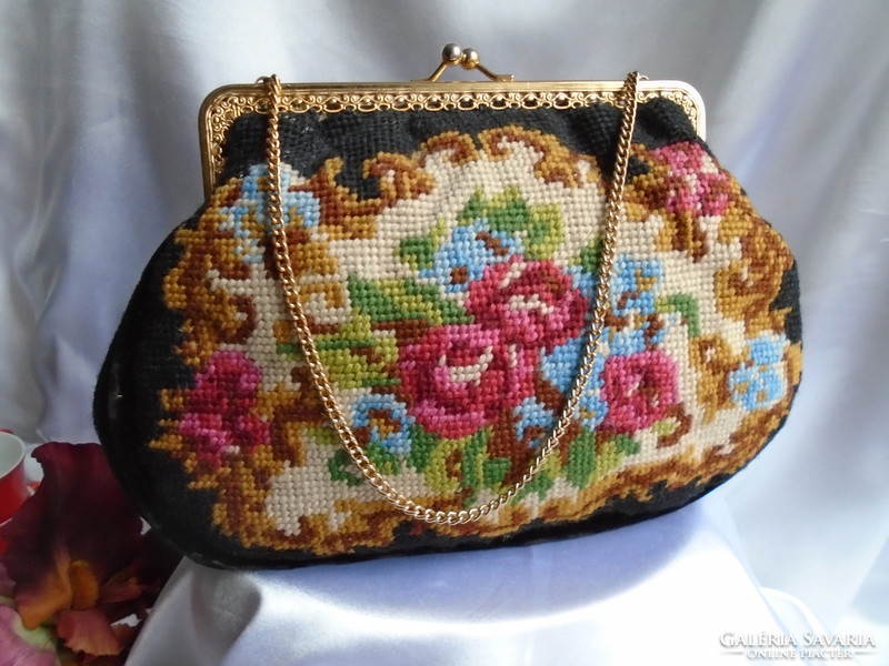 Tapestry bag. Colorful roses and flowers on a black background.