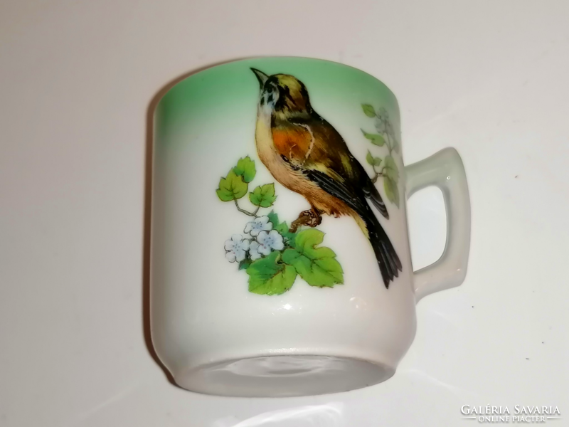 Antique birdie collecting coffee cup