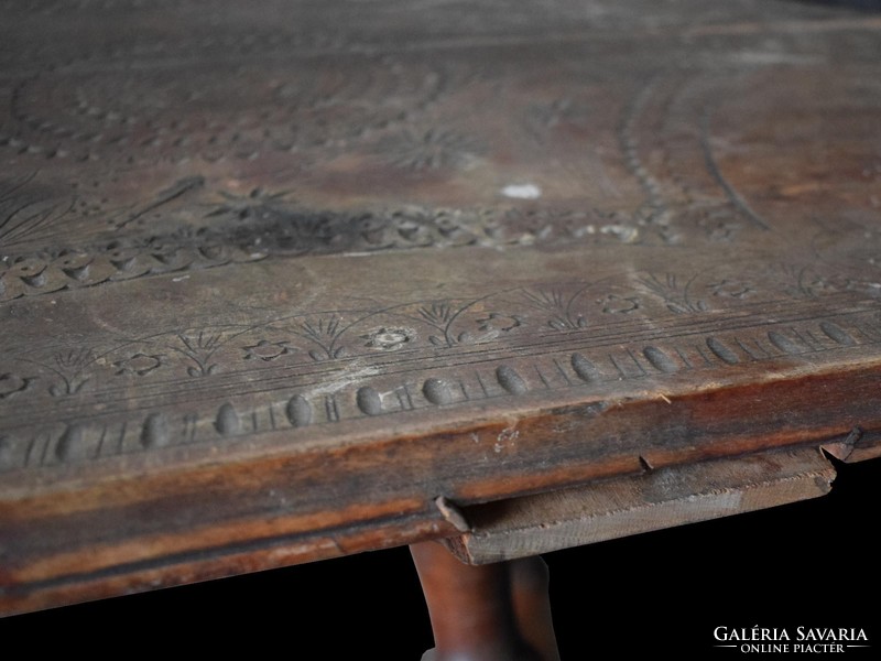 Small table with carved, engraved top
