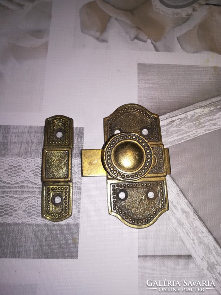 Old copper latched furniture lock