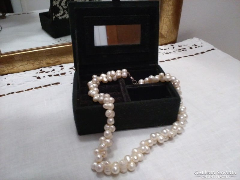 Black velvet jewelry box with white pattern and mirror