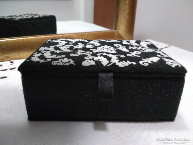 Black velvet jewelry box with white pattern and mirror