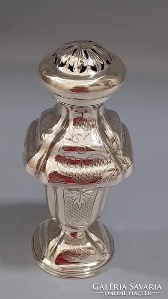 Old silver sugar shaker with spice rack