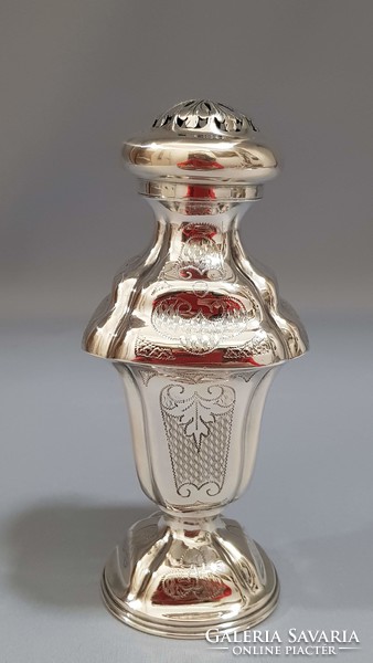 Old silver sugar shaker with spice rack