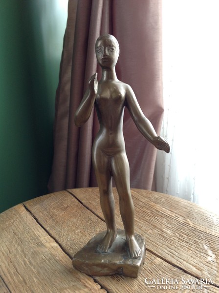 Old danger present copper statue of female nude