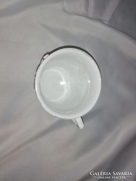 Antique commemorative cup from the early 1900s with a plastic flower ornament