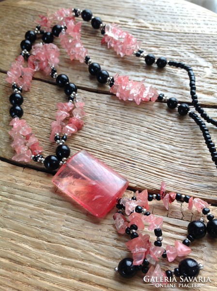 Black beaded necklace decorated with cherry quartz