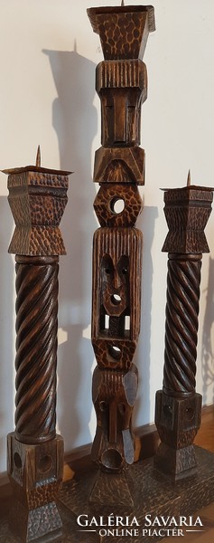 Single wood carved, pierced three-pronged candlestick