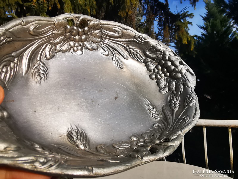 Silvered bowl with bunch of grapes