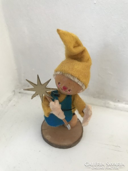 Old Christmas elf with Christmas tree decoration