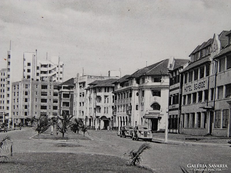 Antique South African cityscape postcard / greeting card in Durban, hotel, cars, rickshaw circa 1910