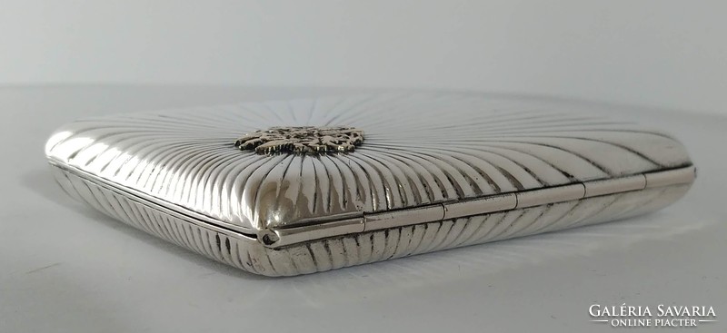 Silver art-deco cigarette wallet with gilded coat of arms