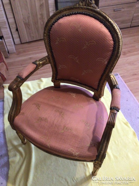 Gilded baroque armchair with armchair