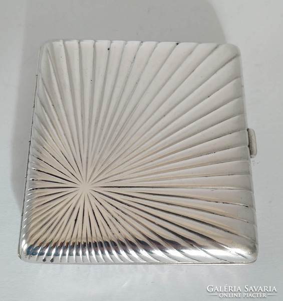 Silver art-deco cigarette wallet with gilded coat of arms