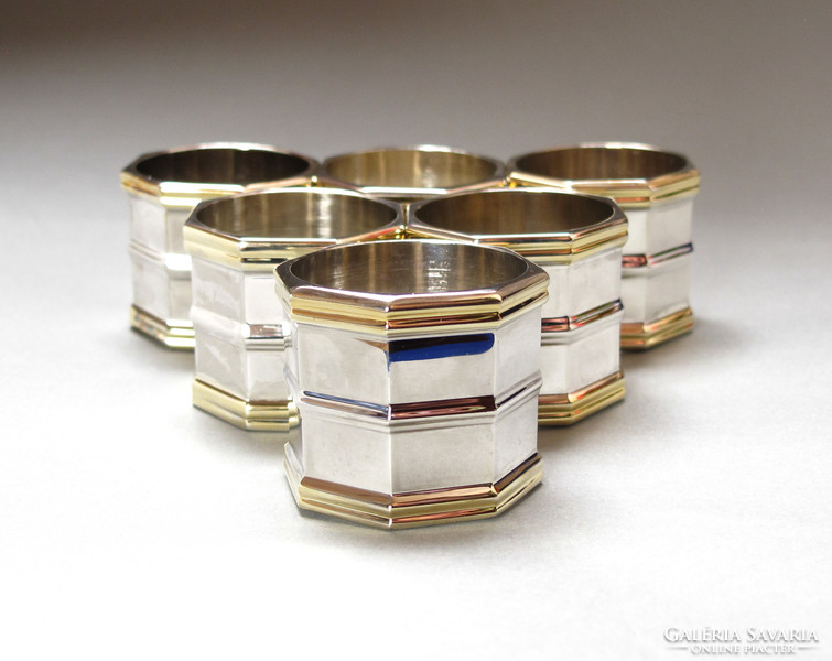 Silver / gold napkin ring set.