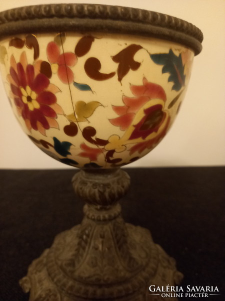 Presumably the bottom of a lamp or a tin goblet with historic enamel decoration