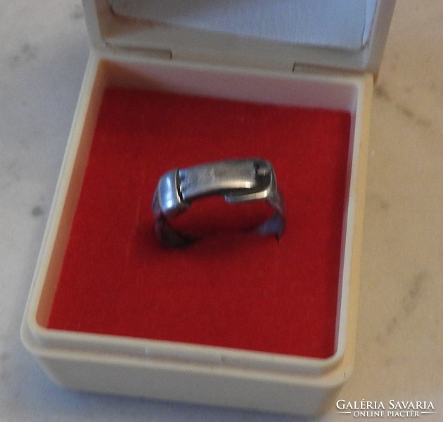 A rare silver ring with a belt pattern