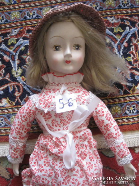 Charming porcelain doll! 56.