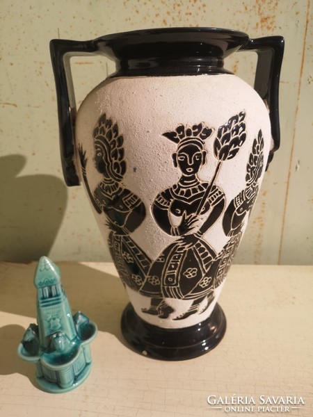 Modern vase / Native American figurines.