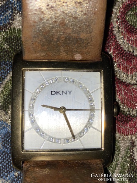 Dkny gold-plated metal watch used with a slightly worn strap