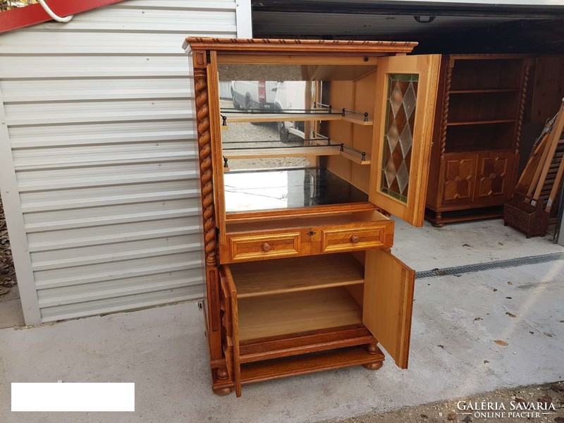 The extra large lead-in colonial bar cabinet is for sale.