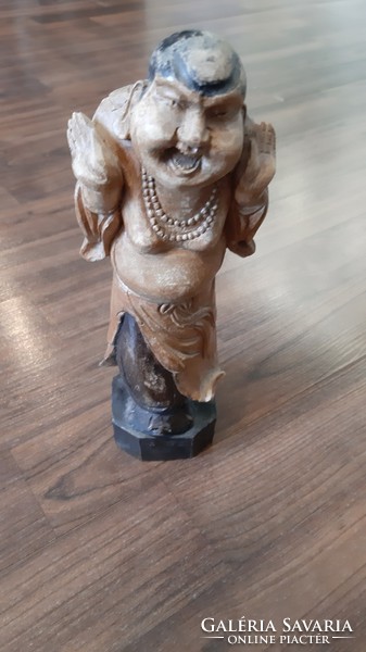 Oriental engraved wooden figure