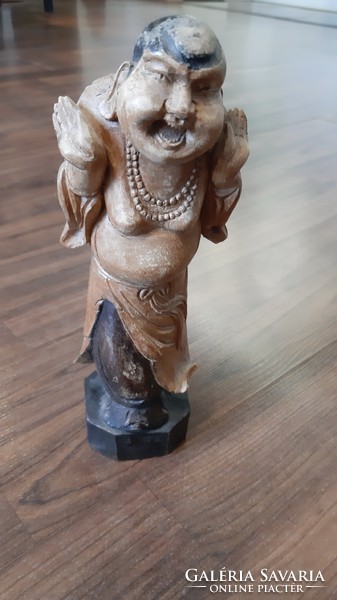 Oriental engraved wooden figure