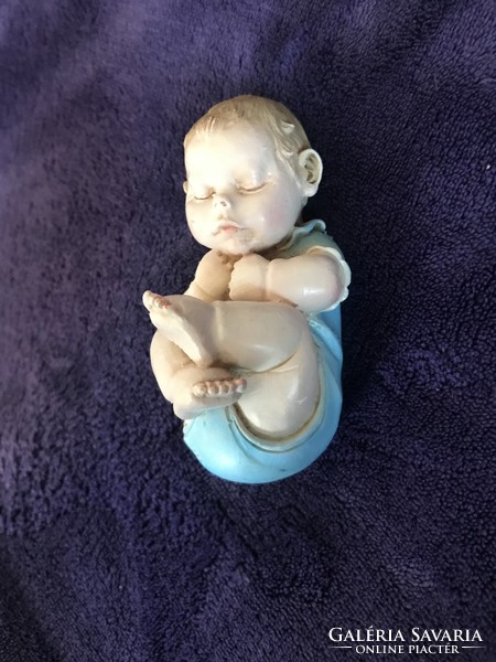 A. Lucchesi is a well-known baby figure with a baby statue on a sleeping baby tooth
