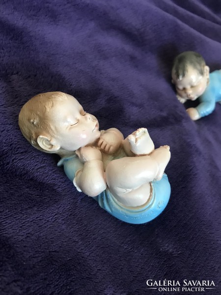 A. Lucchesi is a well-known baby figure with a baby statue on a sleeping baby tooth