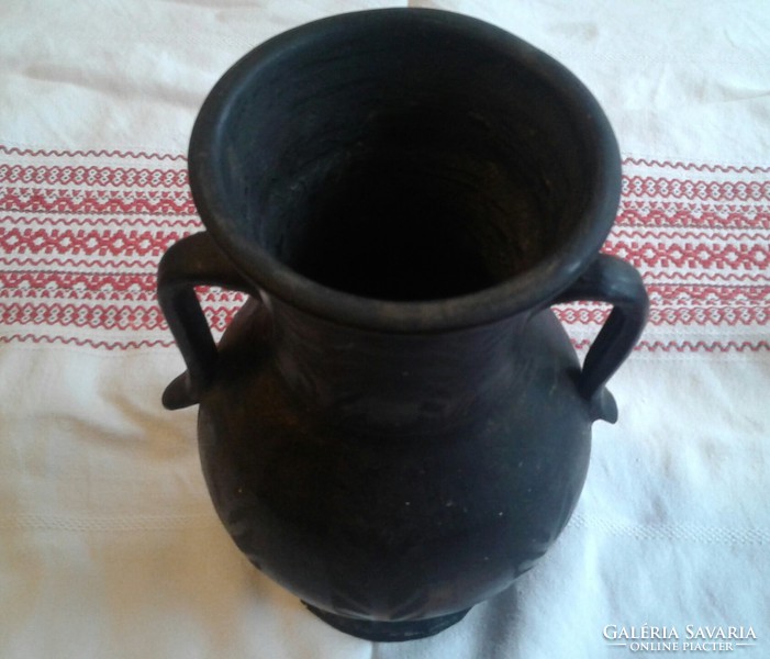 Old black ceramic vase