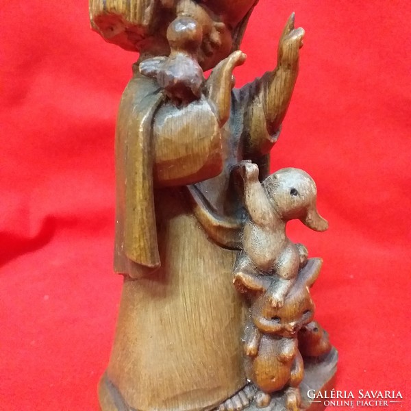 Old wooden little girl with bunnies, charming figure with hand-carved wood.Marked.