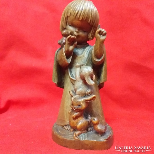Old wooden little girl with bunnies, charming figure with hand-carved wood.Marked.