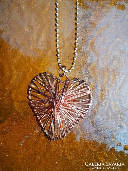 Copper heart pendant on a long chain