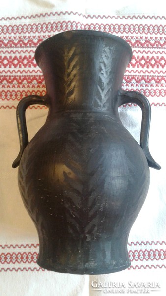 Old black ceramic vase