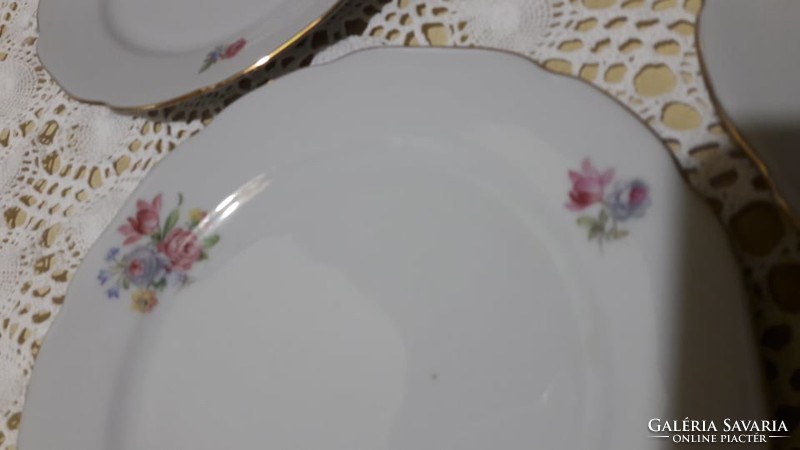 Beautiful, floral, Bulgarian, porcelain cake on a small plate with a golden edge